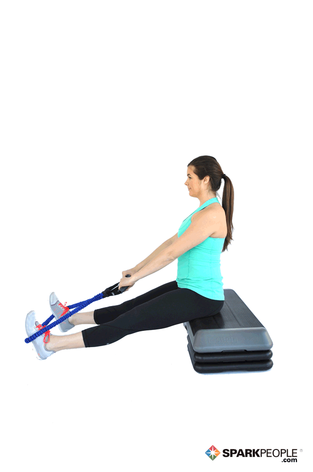 woman doing sitting rows with resistance band